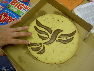 A cookie with the Liberal Democrat bird of liberty logo on it in chocolate