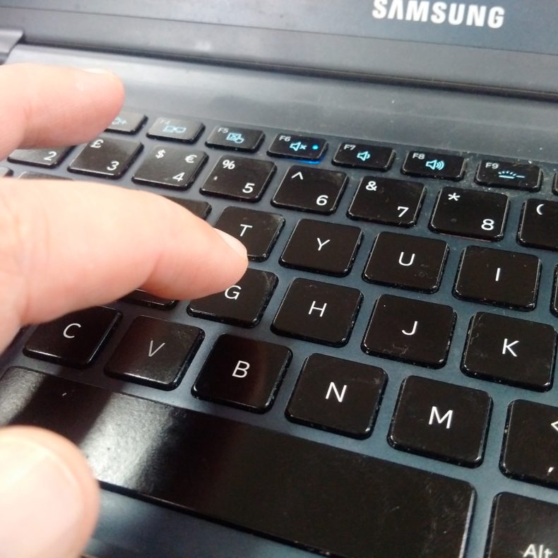 Letter G being pressed on a keyboard