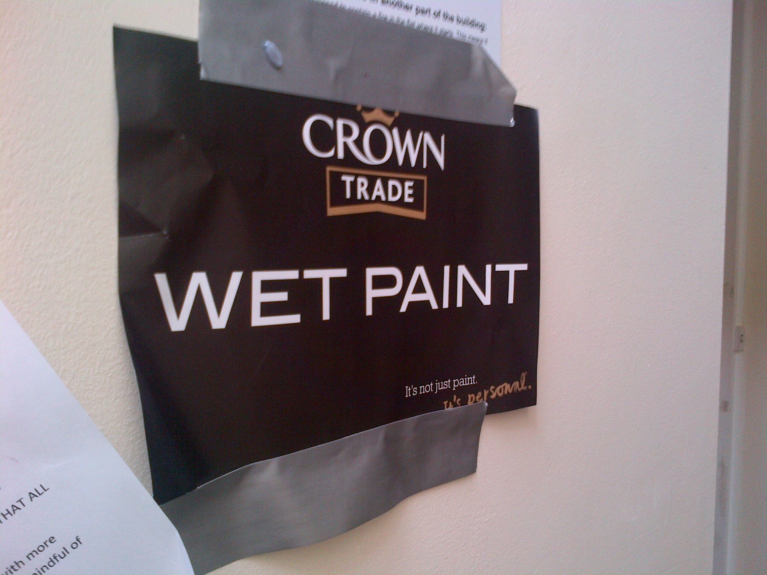 Wet paint sign in Kingston