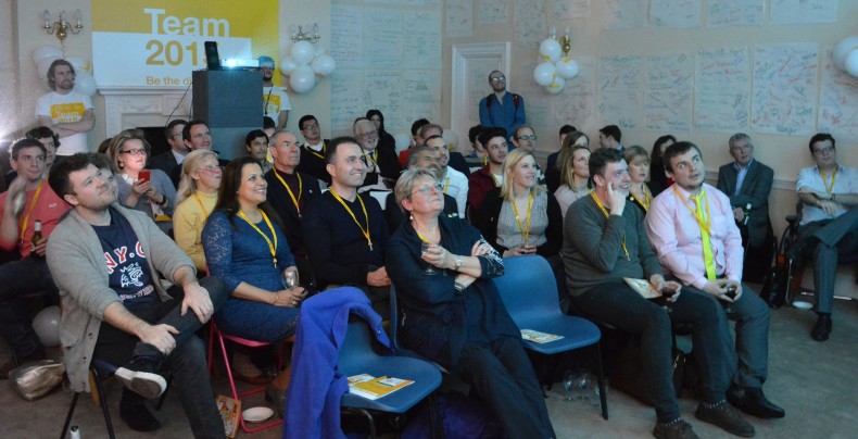 Lib Dem volunteers take a break from phoning to watch the election debate on TV