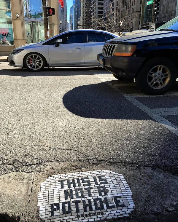 Chicago pothole decorated by Jim Bachor