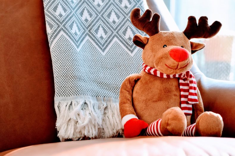 A toy reindeer on a sofa - CC0 Public Domain