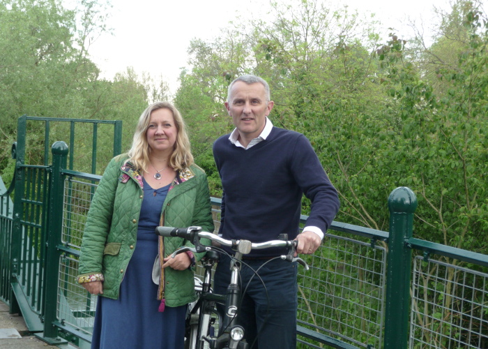 Rod Cantrill on a bridge with a bicycle
