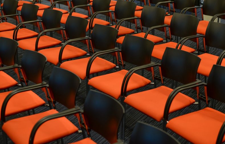 Orange empty seats - CC0 Public Domain