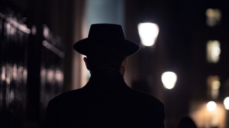 Silhouette of a person with a hat