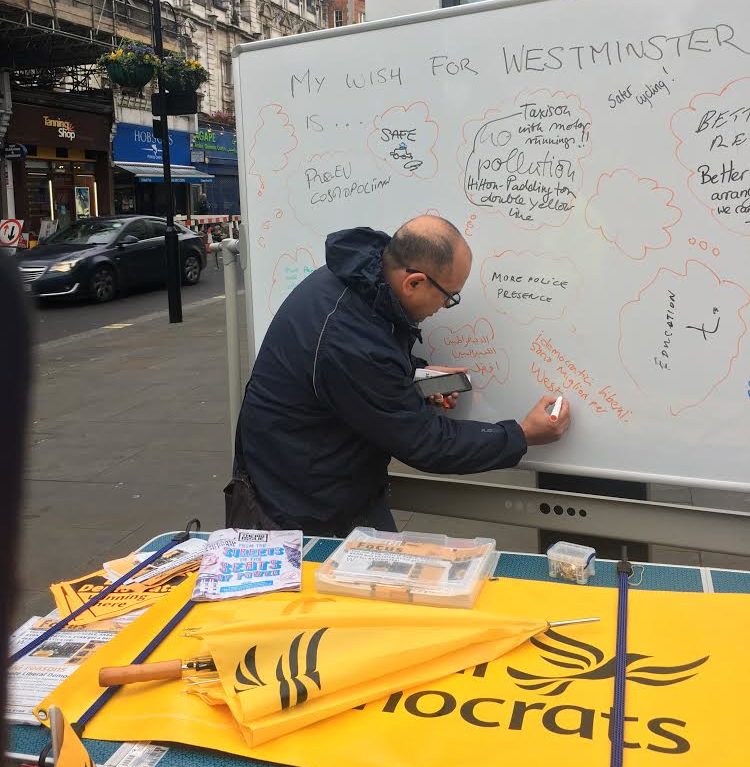 Westminster Liberal Democrats campaigning on the high street with a whiteboard
