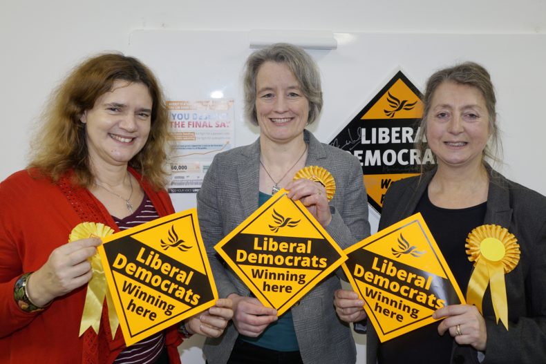 Louise Harris, Claire Young and Dine Romero - Lib Dem PPCs - holding party posters