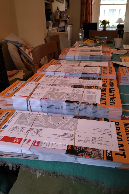 Piles of Liberal Democrat leaflets ready to go