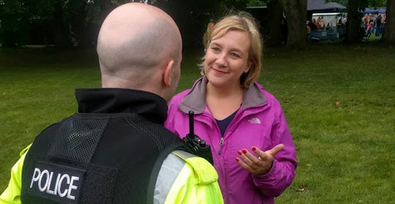 Lisa Smart talking with a police officer