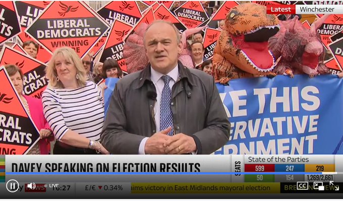 Ed Davey and an inflatable dinosaur celebrate the 2024 May elections